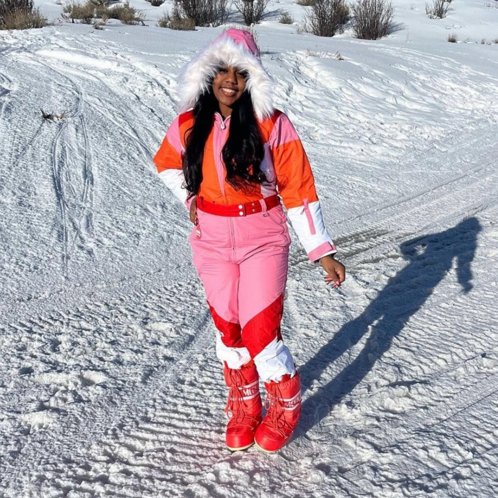 Pink white and orange ski suit
